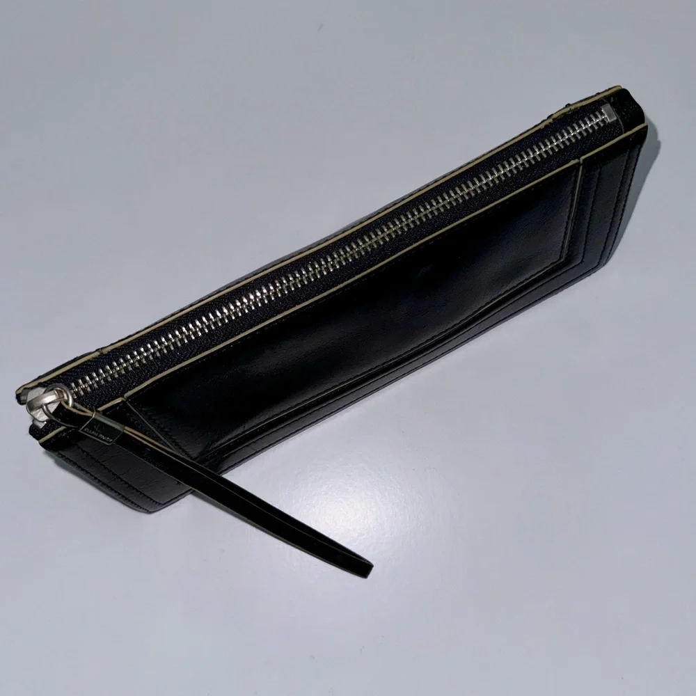 Ellen Tracy Black Leather Clutch with red logo interior.